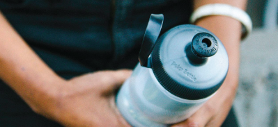 Hands holding water bottle